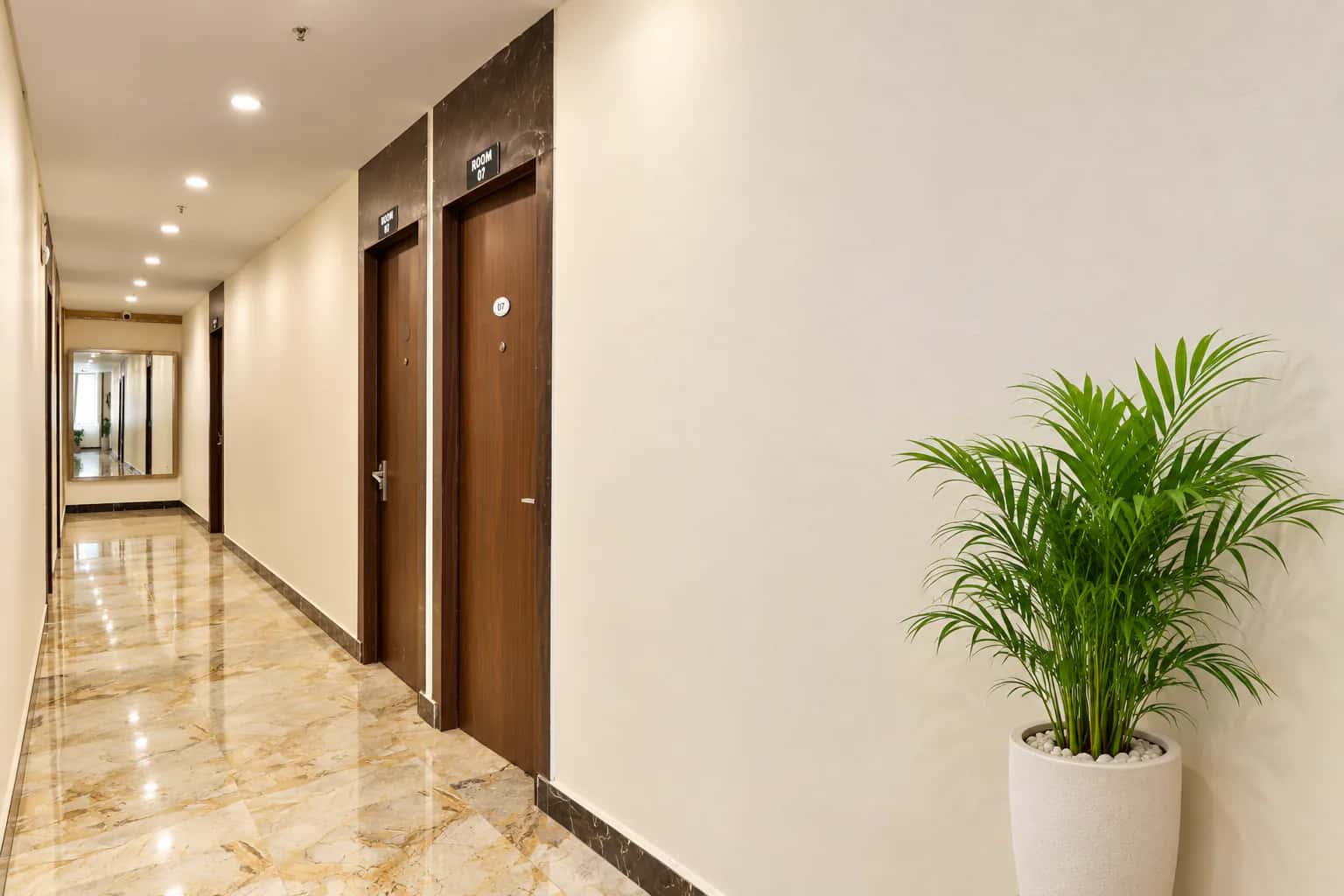 Bright guest corridor with marble floors