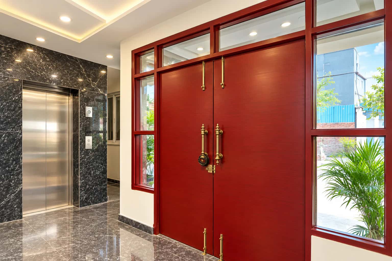Lift lobby beside the carved entrance doors