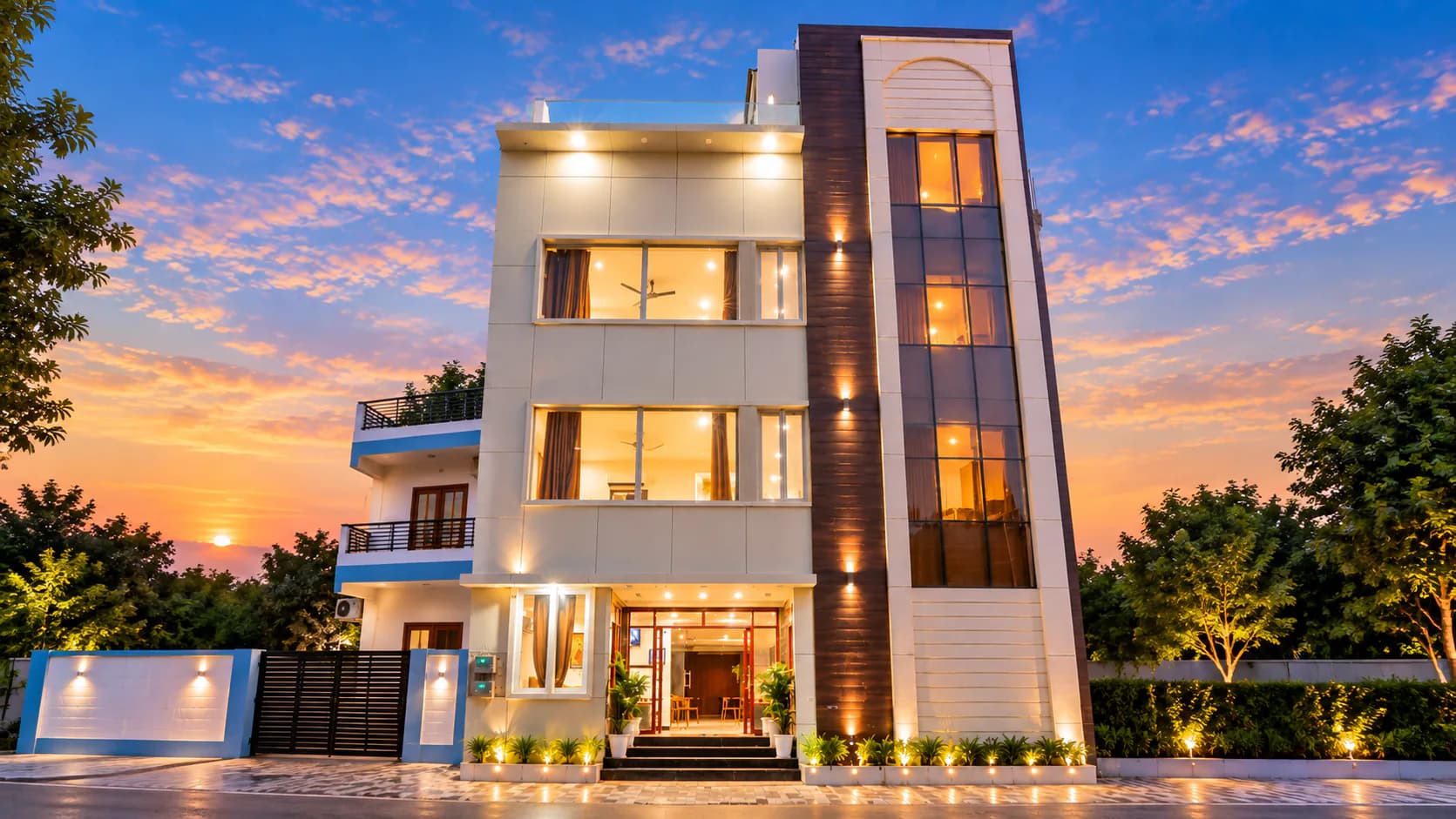 Hotel Palassio International lit up at sunset