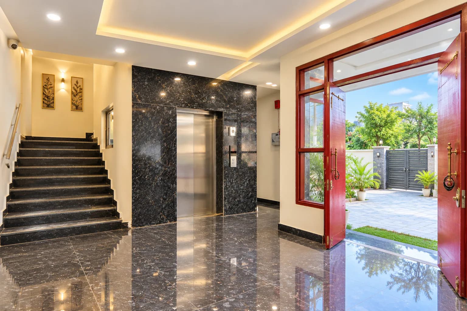 Lobby staircase and lift by the main doors